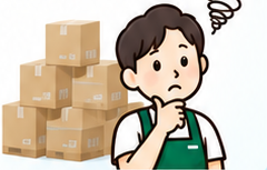 段ボールの前で悩む店舗スタッフ